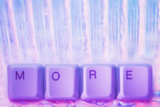 Close_up of text More made by computer keys