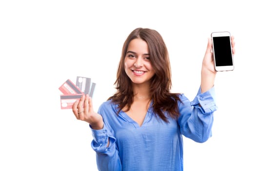 E-commerce concept - Happy woman holding credit cards