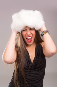 A beautiful young woman dressed with winter clothes