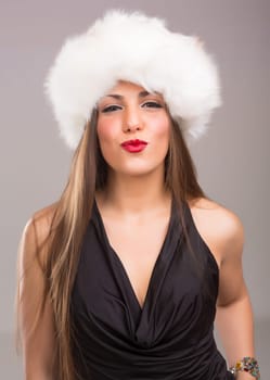 A beautiful young woman dressed with winter clothes