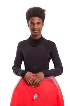 A young black bodyboarder posing in studio