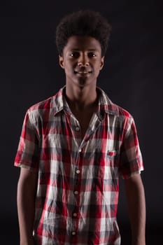 A casual young black boy posing isolated