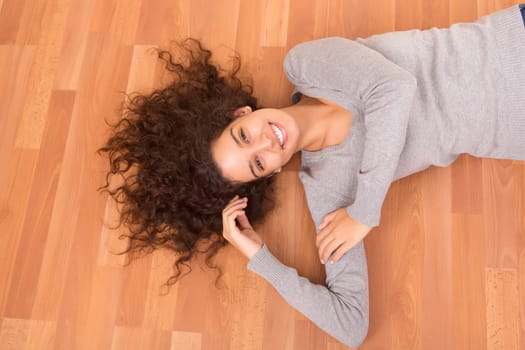 Happy woman relaxing in her new house