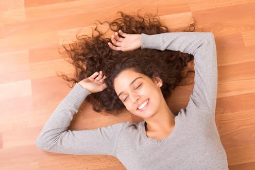 Happy woman relaxing in her new house