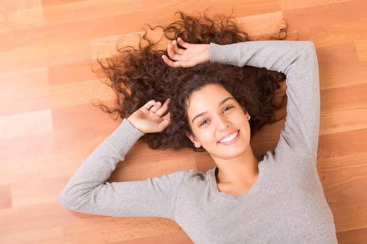 Happy woman relaxing in her new house