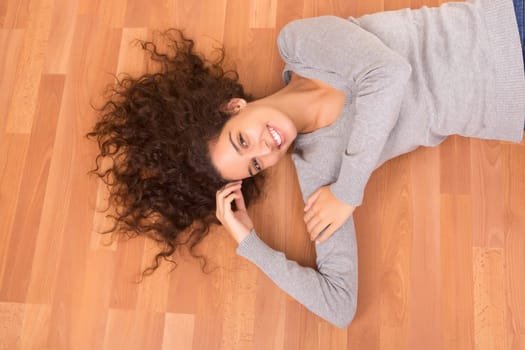 Happy woman relaxing in her new house