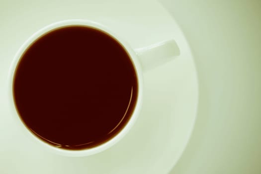 Close_up of a coffee cup with a saucer