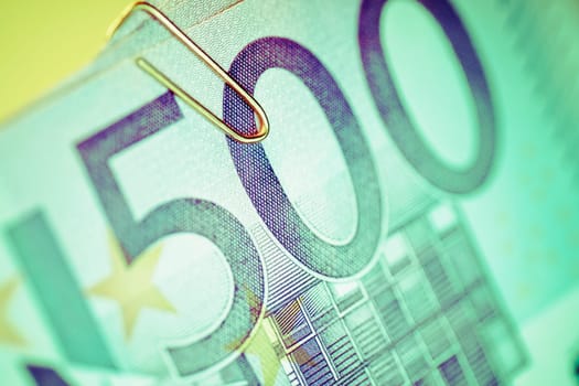 Close_up of five hundred euro banknotes with a paper clip