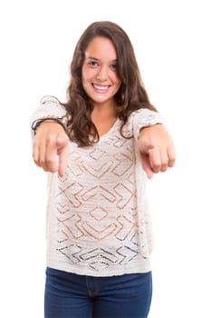 Young beautiful woman pointing at you, isolated over white