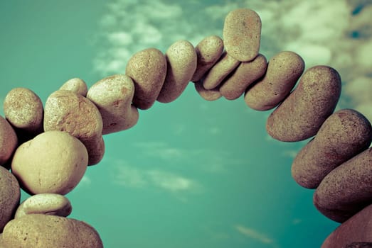 Pebbles arranged in an arch shape
