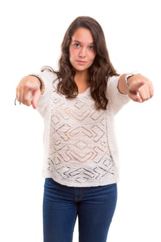 Young beautiful woman pointing at you, isolated over white