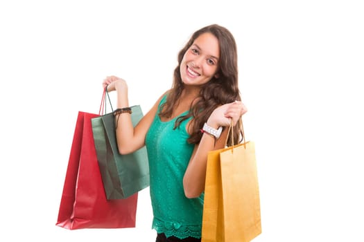 Young beautiful woman with shopping bags, isolated over copy space background