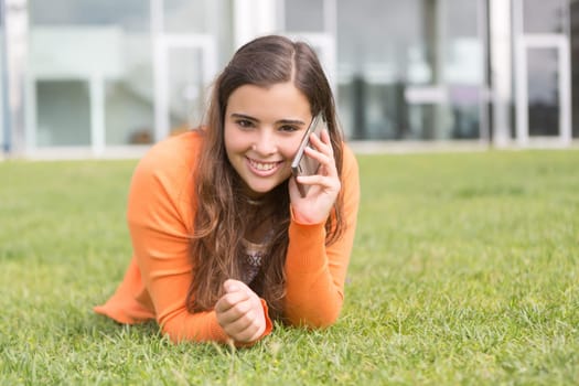 A beautiful young woman relaxing at the city park