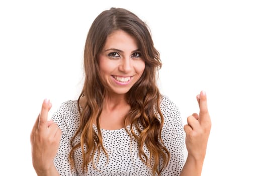 Woman with crossed fingers, isolated over a white background