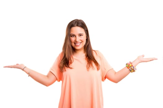 Young beautiful woman presenting your product, isolated over white background