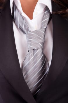 Detail of woman's suit and tie