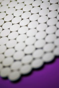 Close_up of pills in a row