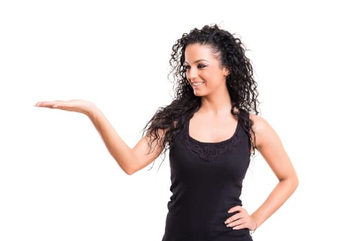 Young beautiful woman presenting your product, isolated over white background