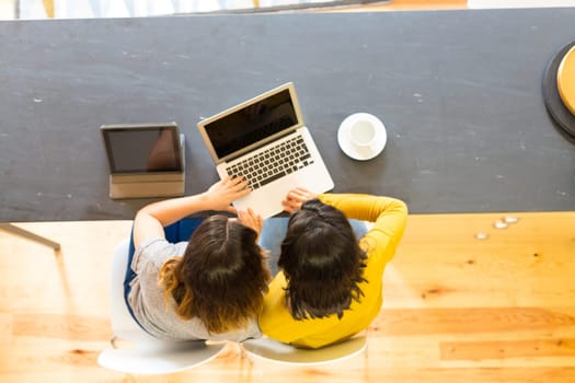 Beautiful young women at home studying for the final exams