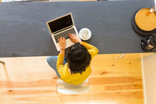 Young woman working at home in the morning