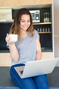 Young woman working at home in the morning