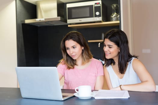 Beautiful young women at home studying for the final exams
