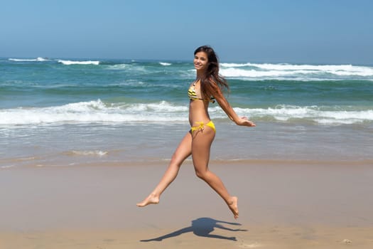 Beautiful young woman relaxing at the beach