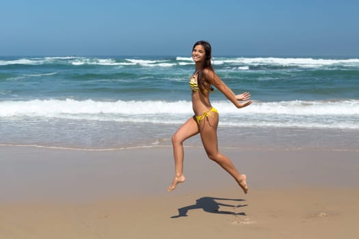 Beautiful young woman relaxing at the beach