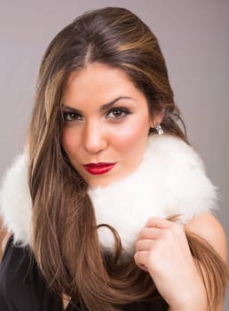 A beautiful young woman dressed with winter clothes