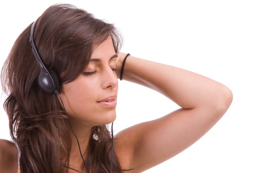 Young girl listening to music, isolated over white