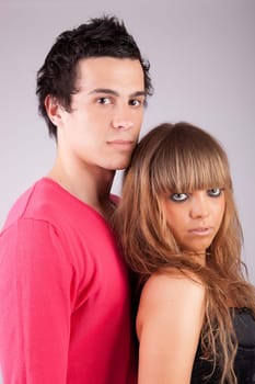 Young casual couple posing isolated