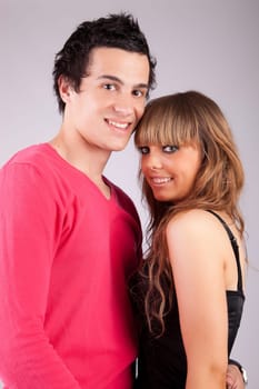 Young casual couple posing isolated