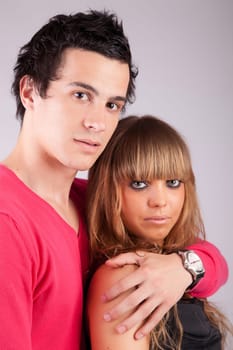 Young casual couple posing isolated