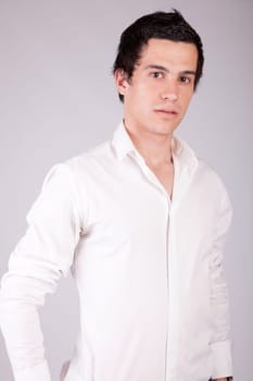 Young casual boy posing isolated