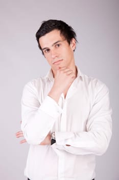 Young casual boy posing isolated