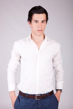 Young casual boy posing isolated