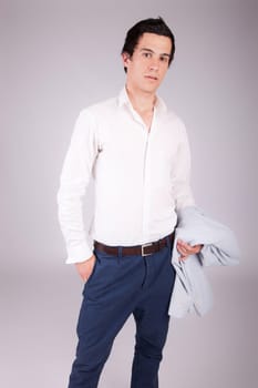 Young casual boy posing isolated