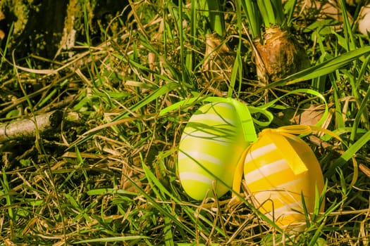 Colorful easter eggs on green grass