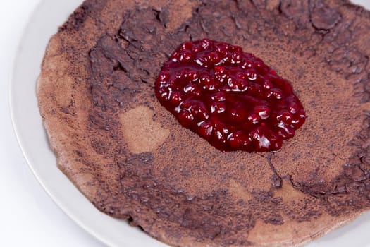 Blood Pancake made from raindeer blood served with Lingonberry Jam.