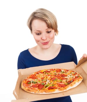 Young woman holding a pizza from fast food and looking very attracted, isolated on white