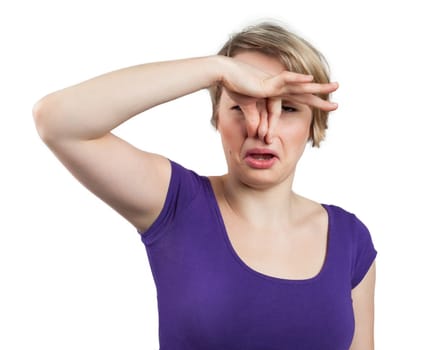 Portrait of a woman touching her noise, bad smelling concept, isolated on white