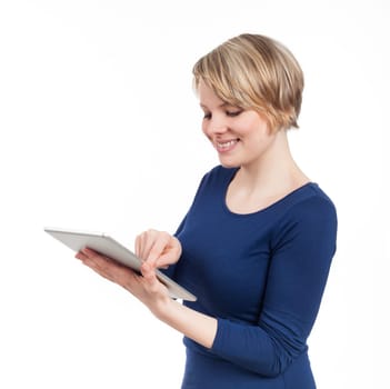 Young woman writing on an electronic tablet, isolated on white