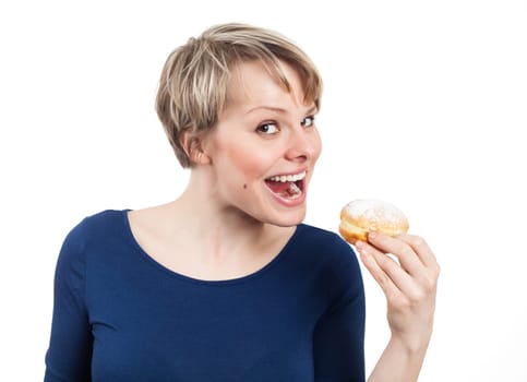 Funny woman about eating a donut, isolated on white