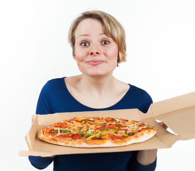 Young woman holding a pizza from fast food and smiling, isolated on white