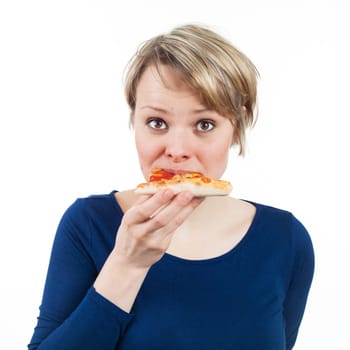 Young woman eating a slice of pizza, isolated on white