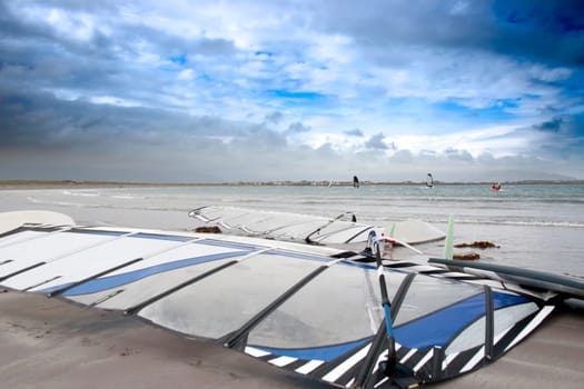 wind surfers braving the storm winds on the wild atlantic way in county Kerry Ireland