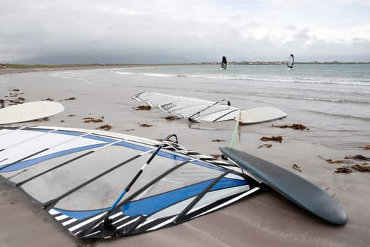 wind surfers braving the storm winds on the wild atlantic way in county Kerry Ireland
