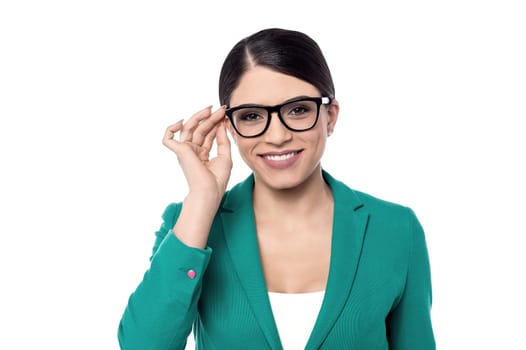 Business woman adjusting her eye glasses