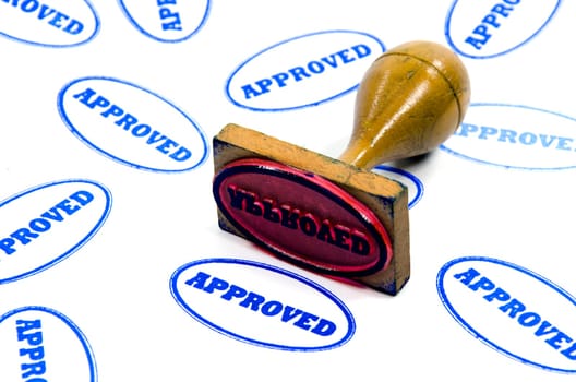 Wood-handled stamp printed on white paper approved
