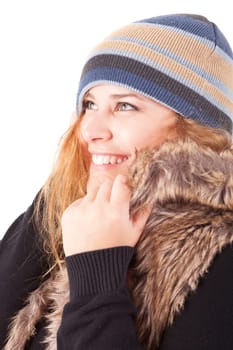 A beautiful young woman dressed for winter, over a white background